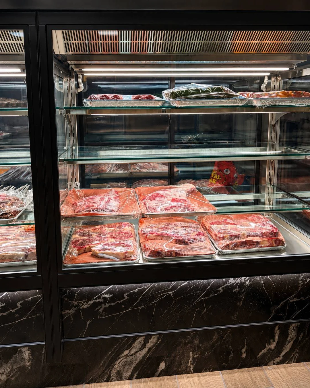 Meat cuts displayed inside Prime Halal Meat’s Welsh Road Suite 15 butcher shop