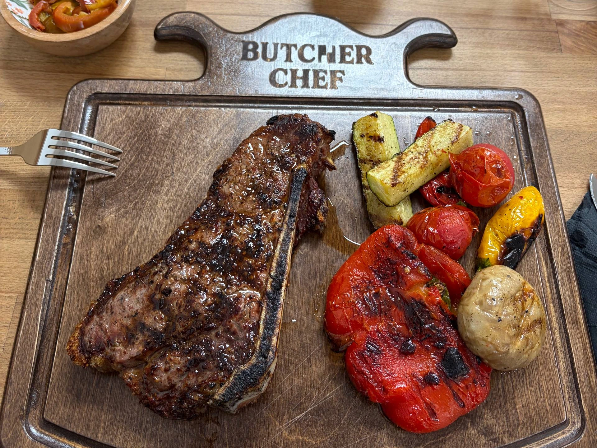 Butcher-Chef’s steak and grilled vegetables served on its signature wooden board